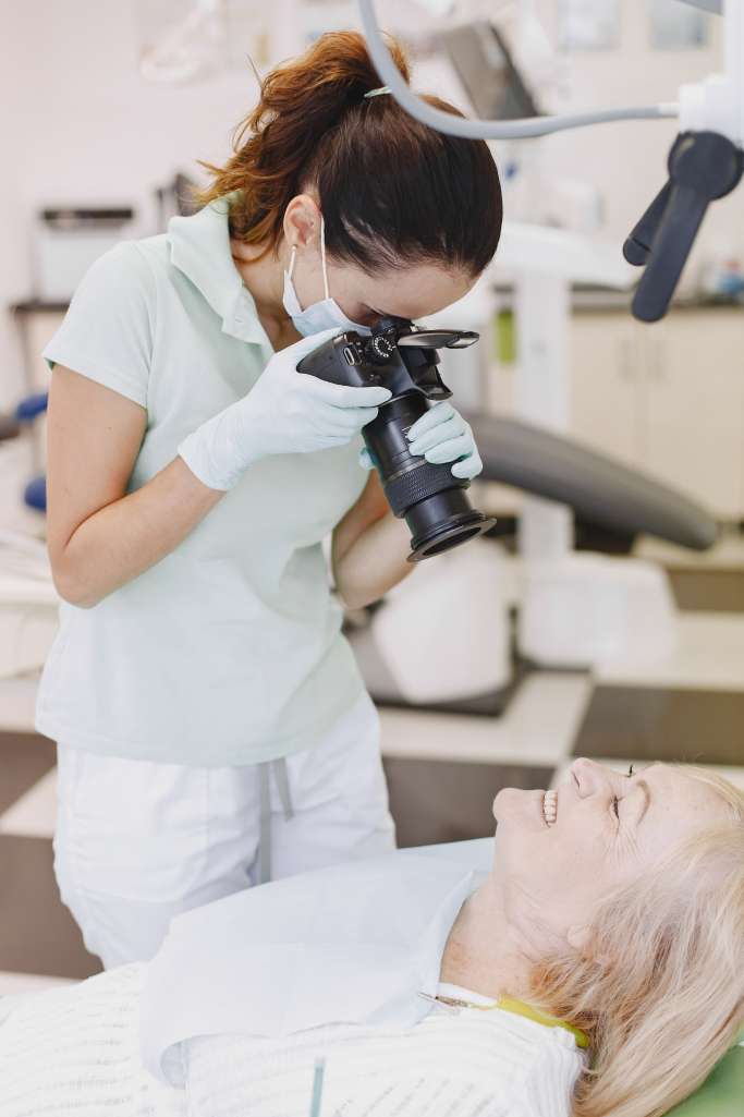 senior-woman-having-dental-treatment-dentist-s-office-doctor-make-photo-patient-s-teeth (2)